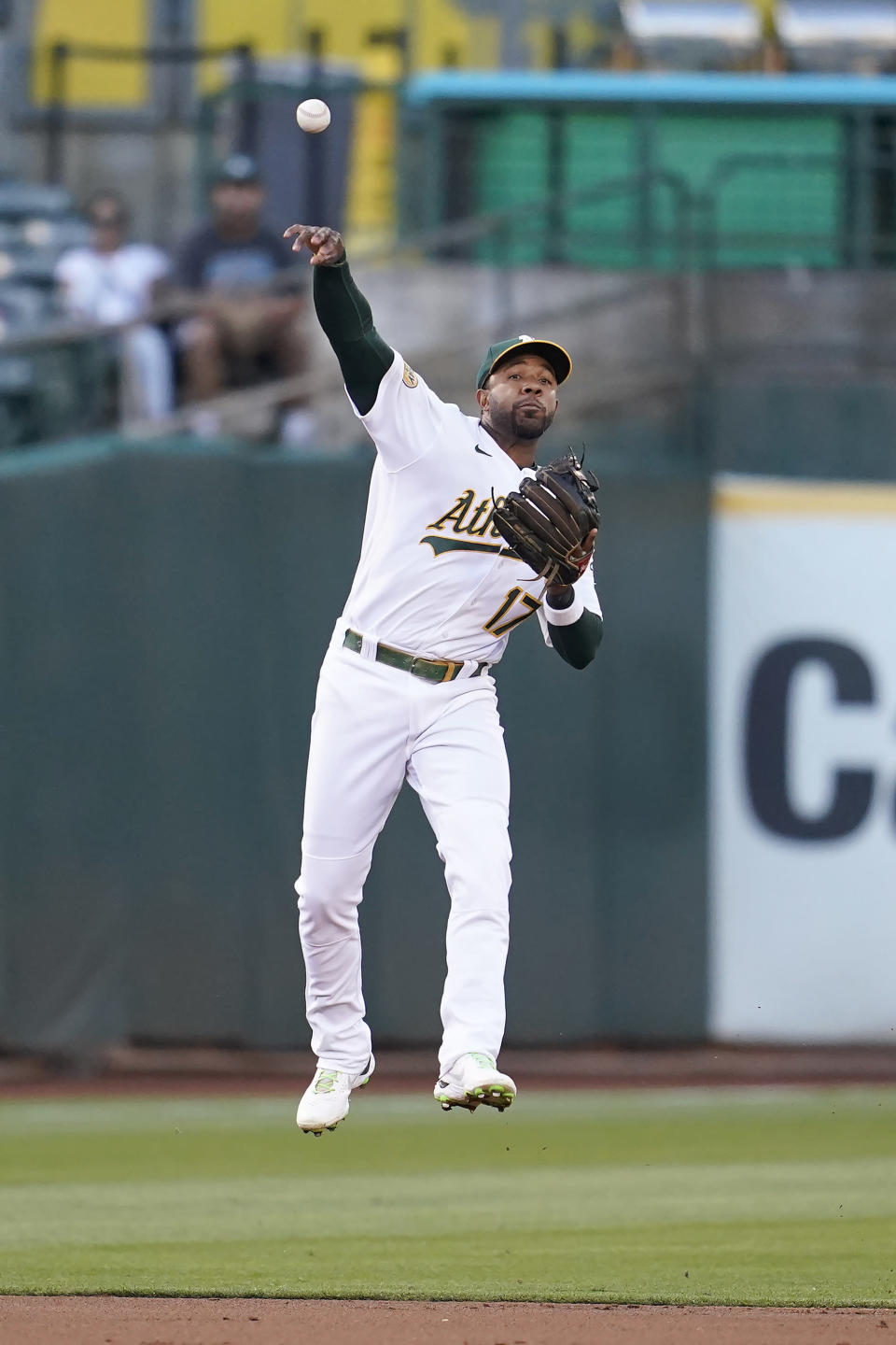 Oakland Athletics shortstop Elvis Andrus throws out Los Angeles Angels' Taylor Ward at first base during the third inning of a baseball game in Oakland, Calif., Monday, Aug. 8, 2022. (AP Photo/Jeff Chiu)
