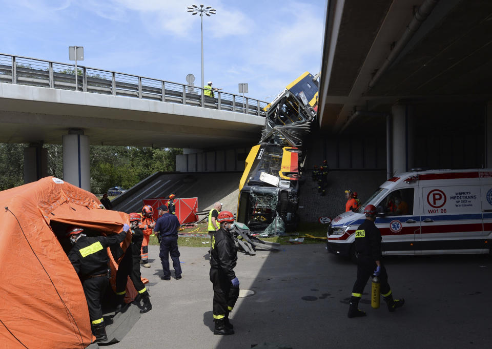 The wreckage of a Warsaw city bus is shown after the articulated bus crashed off an overpass, killing one person and injuring about 20 people, in Warsaw, Poland, on June 25, 2020. The accident forced Warsaw Mayor Rafal Trzaskowski, who is a runner-up candidate in Sunday presidential election, to suspend his campaigning.(AP Photo/Czarek Sokolowski)