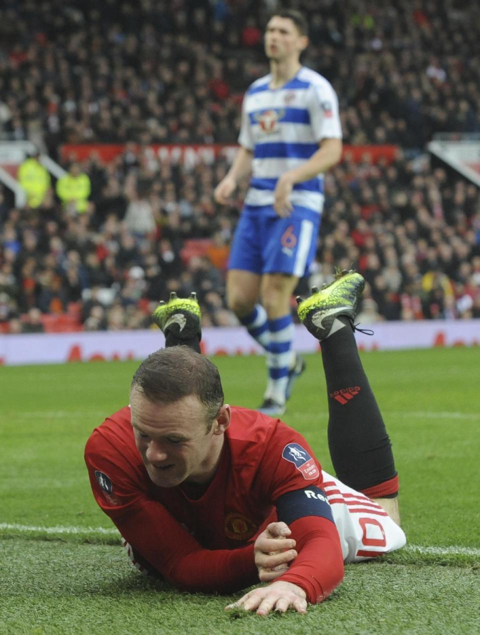 Manchester United's Wayne Rooney lies on the ground after missing a chance to score a goal during the English FA Cup Third Round match between Manchester United and Reading at Old Trafford in Manchester, England, Saturday, Jan. 7, 2017. (AP Photo/Rui Vieira)