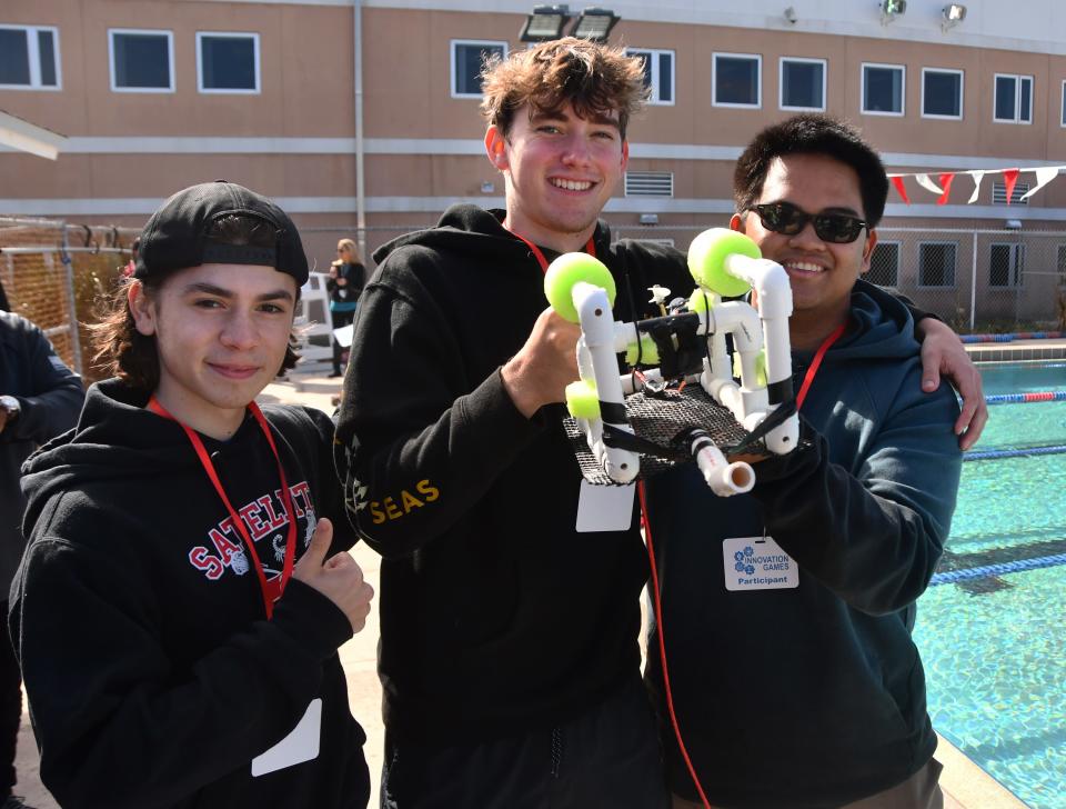 Caiden Sivak, Pierson Mast and Justin Smith, Satellite High Team Titanic, show their SeaPerch ROV (Remote Operating Vehicle) they built for the underwater challenge. Northrop Grumman and Brevard Public Schools held their Innovation Games at Satellite High on Friday.