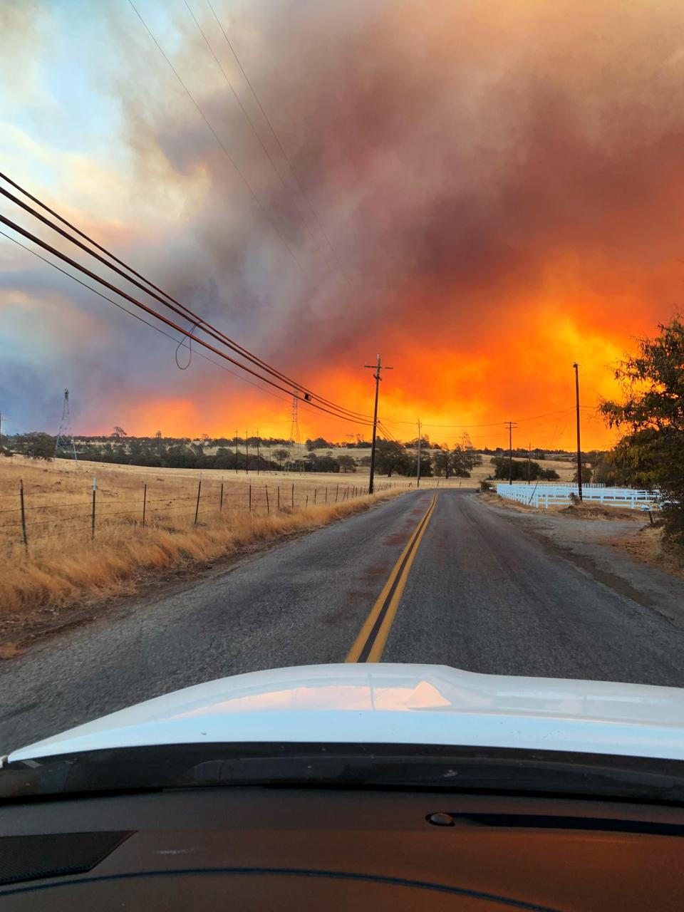 An hour after the blaze started, smoke and flames began blotting out the sun.