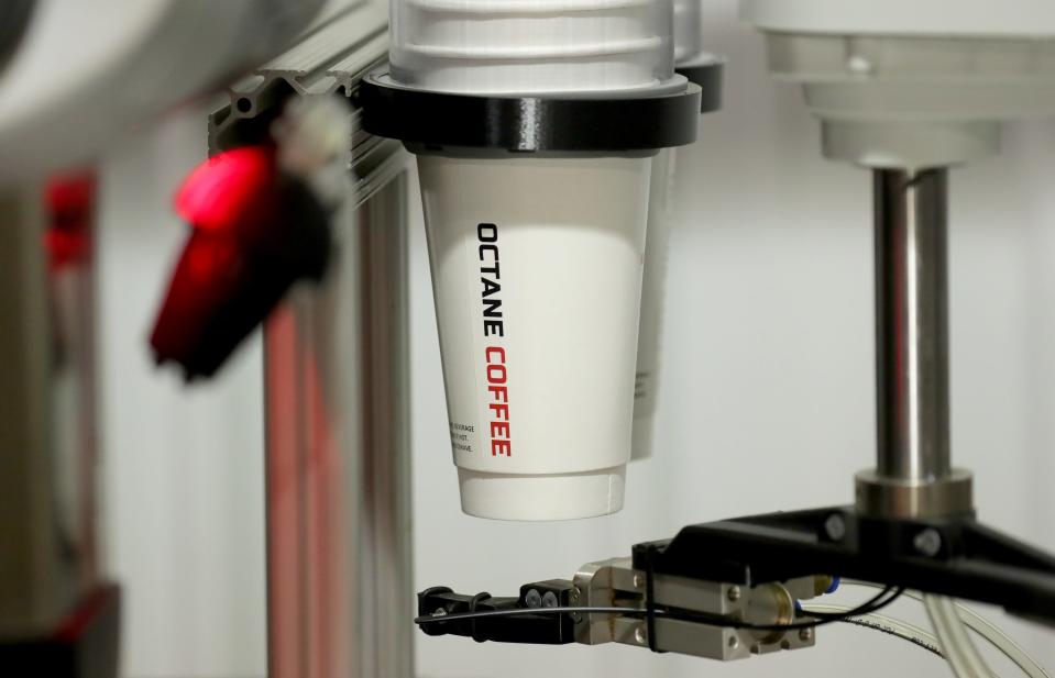 An automated coffee is prepared at the facility Octane Coffee is using to build its automated drive-thru coffee shop.