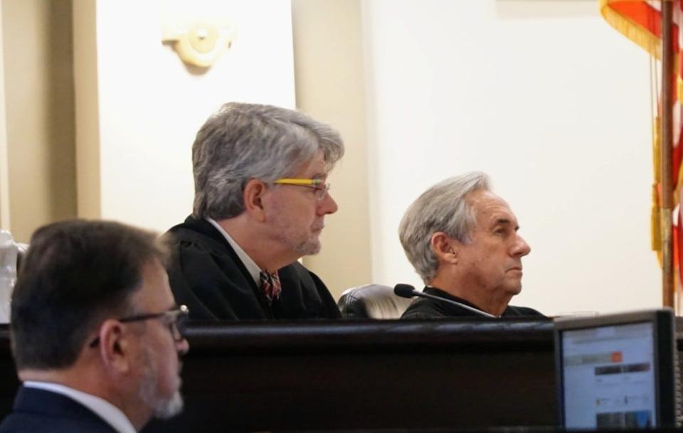 Associate Justices Jimmy Genovese, right, and Jay McCallum listen to arguments during a hearing of the Louisiana Supreme Court on Tuesday, Dec. 7, 2021.