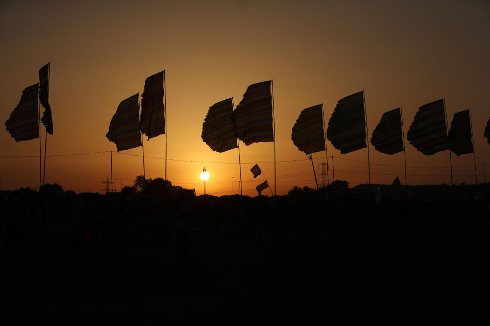 The sun sets over Glastonbury Festival at Worthy Farm, Pilton, Somerset.