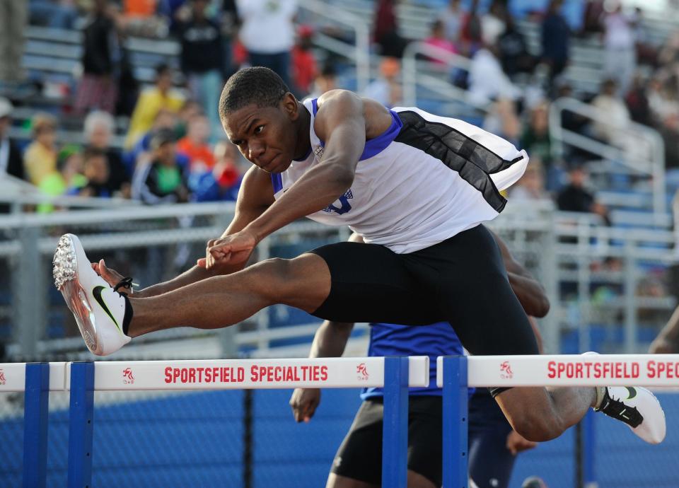 Dover's Mykele Young-Sanders wins the boys 110 hurdles at the annual Meet of Champions track and field meet at Dover High School in 2015.