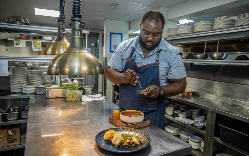 Chef Tristen Epps prepares some dishes in the kitchen at Ocean Social at the Eden Roc Miami Beach. Pedro Portal