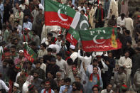 Supporters of Pakistani opposition leader Imran Khan's Tehreek-e-Insaf party attend a rally, in Peshawar, Pakistan, Tuesday, Sept. 6, 2022. Since he was toppled by parliament five months ago, former Prime Minister Imran Khan has demonstrated his popularity with rallies that have drawn huge crowds and signaled to his rivals that he remains a considerable political force. (AP Photo/Mohammad Sajjad)