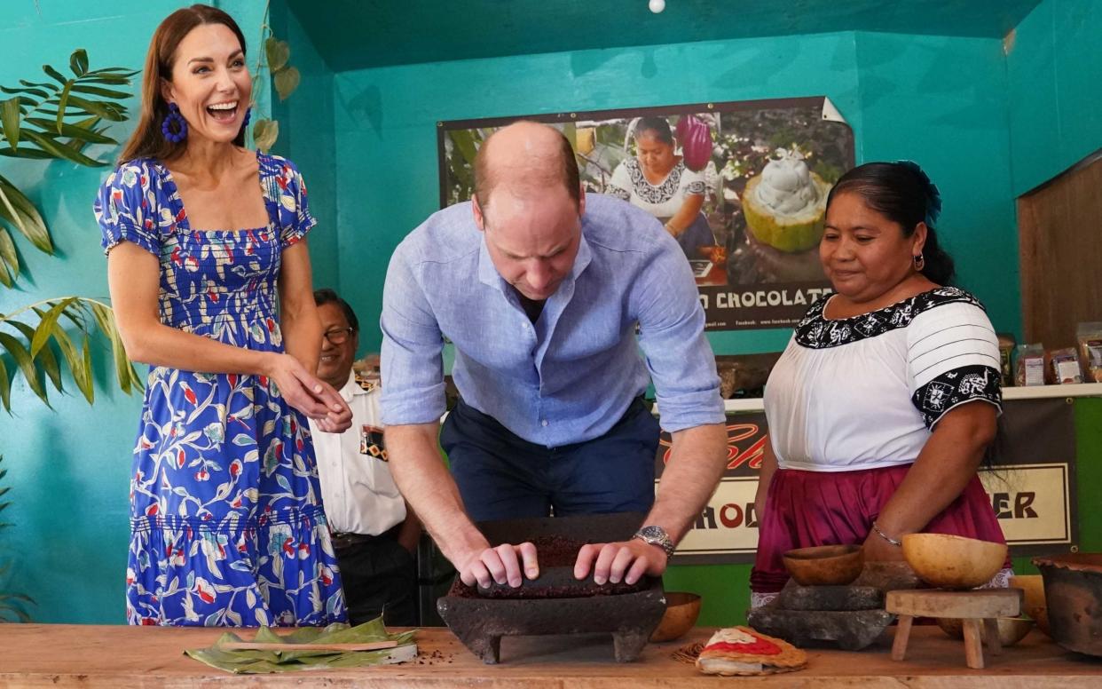 The Duke and Duchess of Cambridge help out at a chocolate farm in Belize - PA