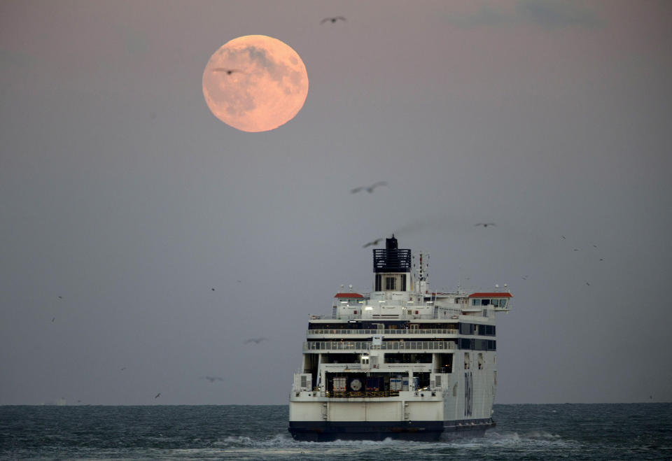 Moon rises over the English Channel in Dover, UK. Photo: Eddie Keogh/Reuters