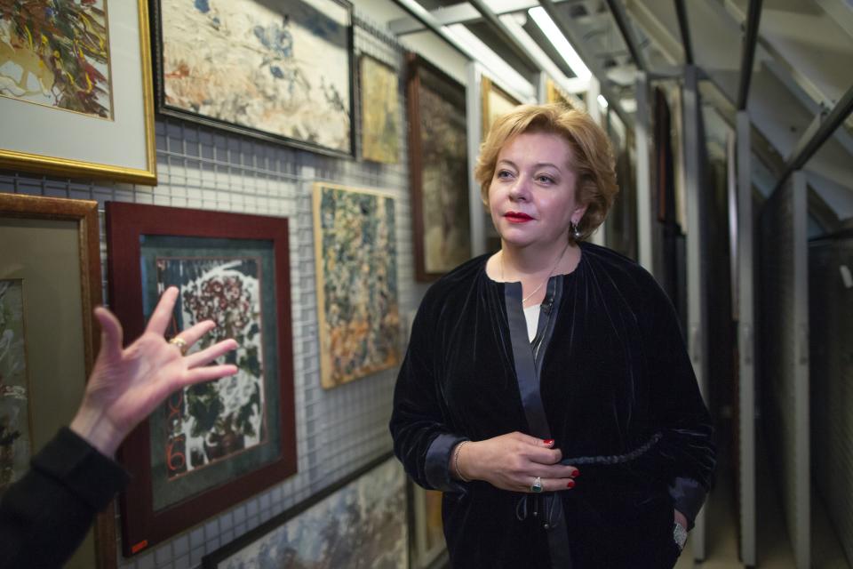 Natalia Opaleva, a banker and head of a Siberian gold mine, and collector of the Soviet-era underground art speaks during an interview with The Associated Press in Moscow, Russia. Opaleva sees collecting art as a personal, even patriotic mission and is determined these neglected Soviet artists will gain global stature. (AP Photo/Alexander Zemlianichenko)