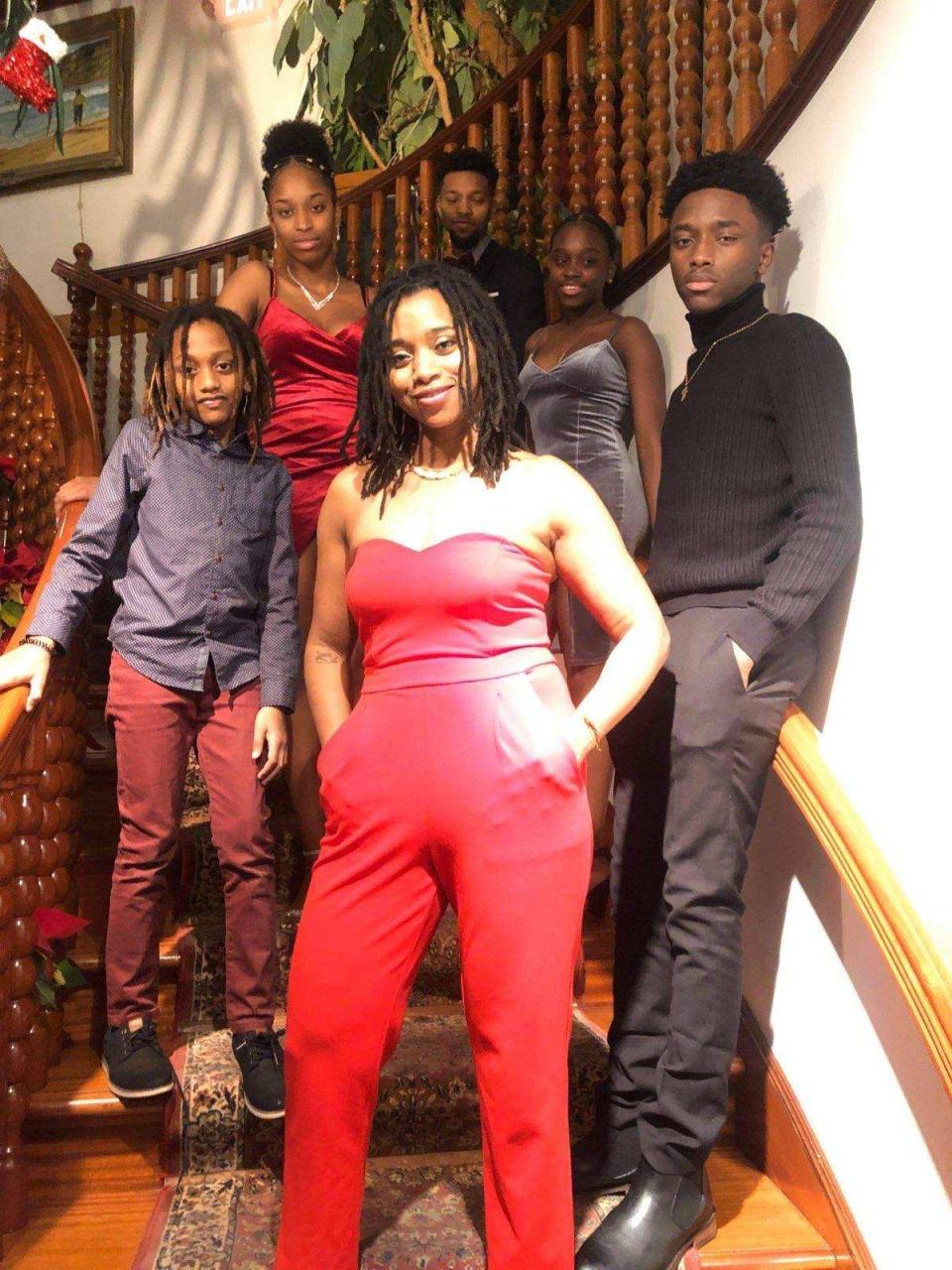 (From left to right) Syedou Tavares, Leylani Moniz, Claudia Tavares, Claudio Moniz, Flavio Moniz and Joseani Moniz in their home in Brockton.