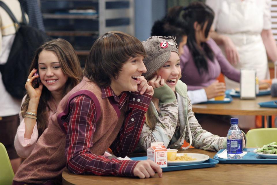 Miley Cyrus, from left, Mitchel Musso and Emily Osment appear in a scene on "Hannah Montana."
