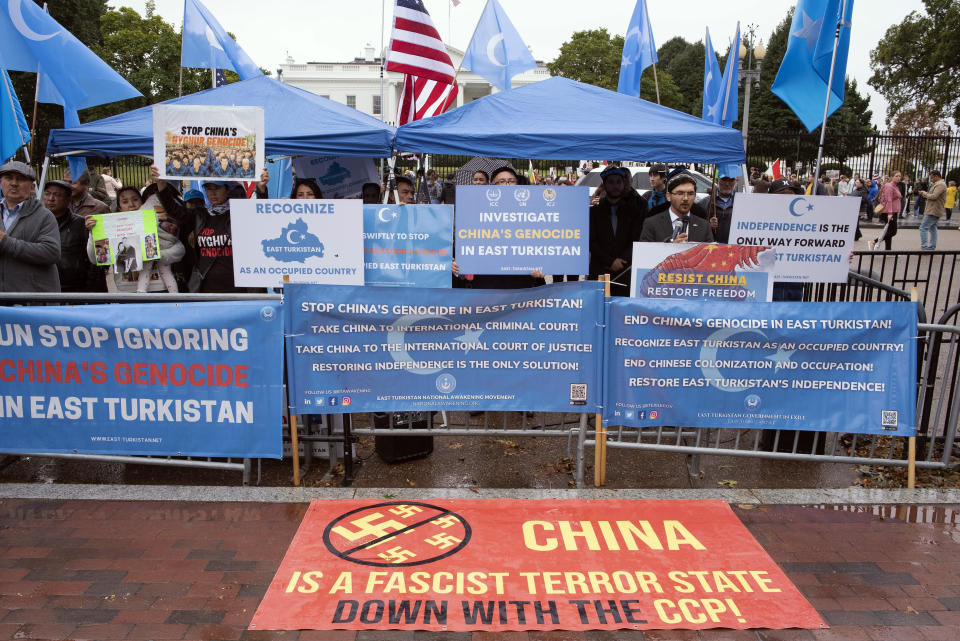 East Turkistan Awakening Movement holds a rally outside the White House against the Chinese Communist Party (CCP) to coincide with the 73rd National Day of the People's Republic of China in Washington, Saturday, Oct. 1, 2022. They protest against alleged oppression by the Chinese government against Uyghurs and other mostly Muslim ethnic groups in far-western Xinjiang province. China's government has been accused of human rights abuses against Uyghurs and other predominantly Muslim minorities in the region. (AP Photo/Cliff Owen)