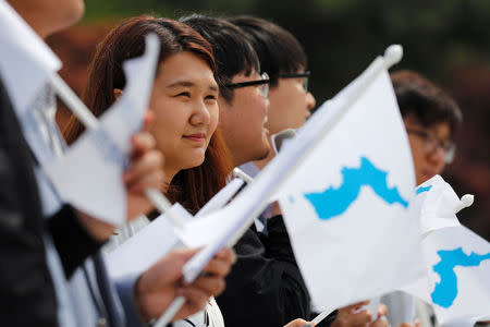 Students hold Korean Unification Flags during a pro-unification rally ahead of the upcoming summit between North and South Korea in Seoul, South Korea April 26, 2018. REUTERS/Jorge Silva