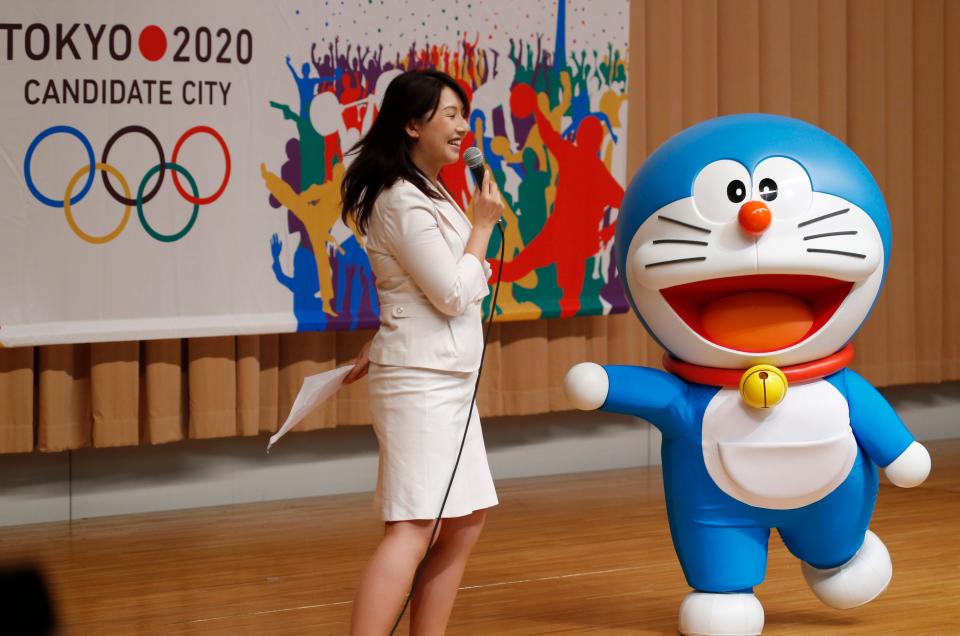 In a Friday, Aug. 23, 2013 file photo, Doraemon, one of the most popular animation characters in Japan, participates in a kick-off ceremony of the Tokyo's bid to host the 2020 Olympics in Tokyo.