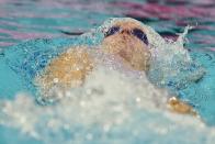 Regan Smith swims on her way to winning the 100-meter backstroke at the U.S. national championships swimming meet, Friday, June 30, 2023, in Indianapolis. (AP Photo/Darron Cummings)