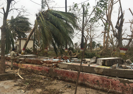 A police officer rests as he sits on a damaged wall following Cyclone Fani in Puri, in the eastern state of Odisha, India, May 5, 2019. REUTERS/Jatindra Dash NO RESALES. NO ARCHIVES.