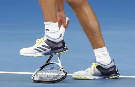 Tennis - Australian Open - Rod Laver Arena, Melbourne, Australia, January 20, 2018. Alexander Zverev of Germany breaks his racquet during his match against Chung Hyeon of South Korea. REUTERS/Thomas Peter