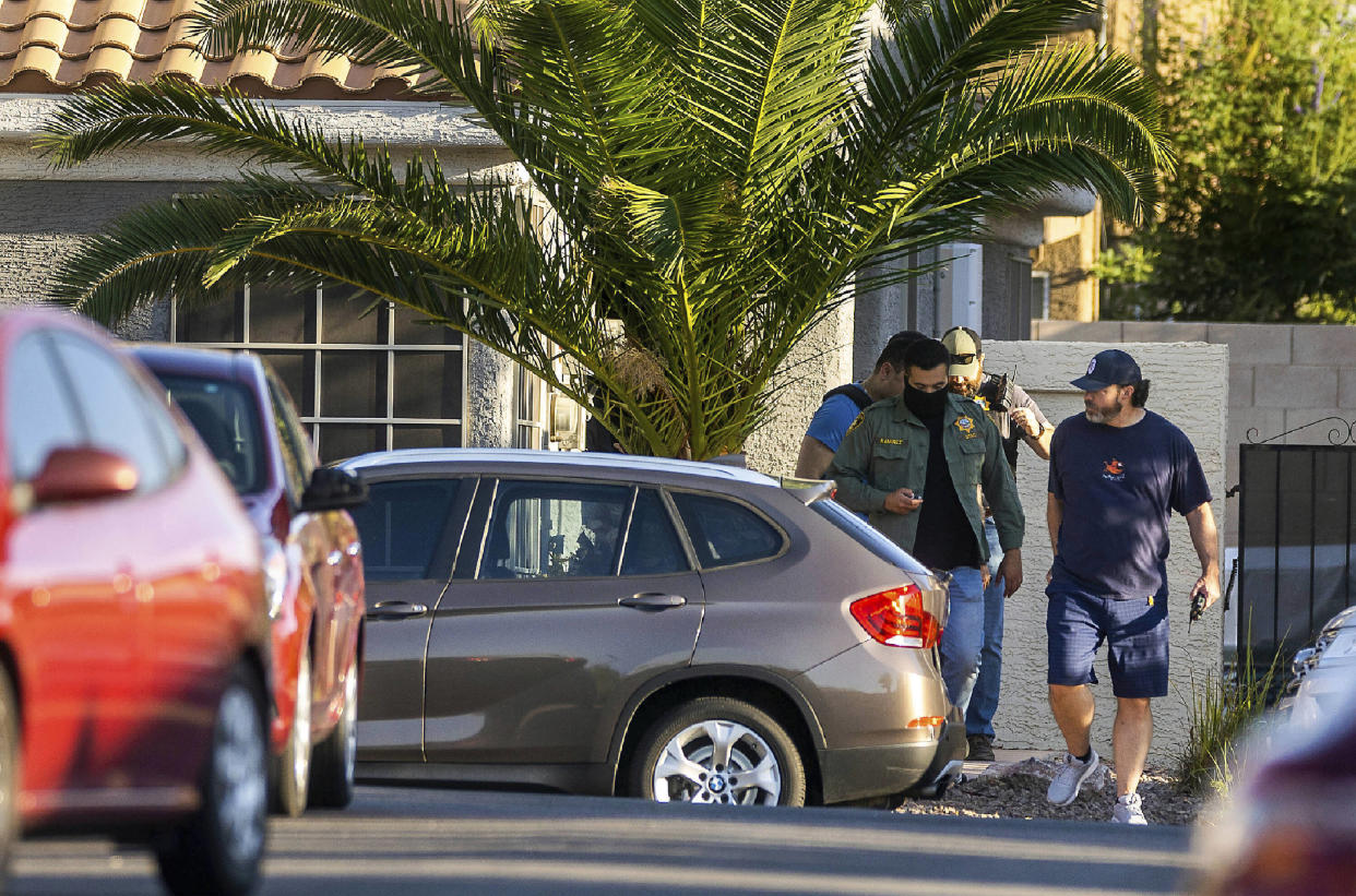 Metro Officers depart the home of Robert Telles on Wednesday, Sept. 7, 2022, in Las Vegas. Authorities served search warrants at Telles home on Wednesday, Sept. 7, 2022, in connection with the fatal stabbing of Las Vegas Review-Journal investigative reporter Jeff German. (L.E. Baskow/Las Vegas Review-Journal via AP)