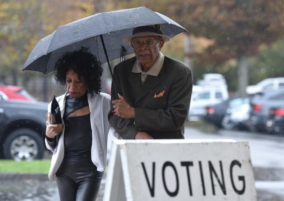 Stephen Smith and his wife Roberta arrived in style for the weather, avoiding a steady rain to cast their ballots for precinct 13 at the Hyannis Youth and Community Center on Election Day for the Town of Barnstable.