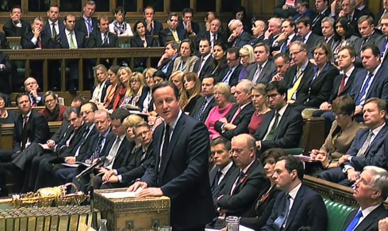 British Prime Minister David Cameron (C), pictured at the dispatch box in the House of Commons in London on November 26, 2015, says parliament will hold a vote on joining air strikes on Syria