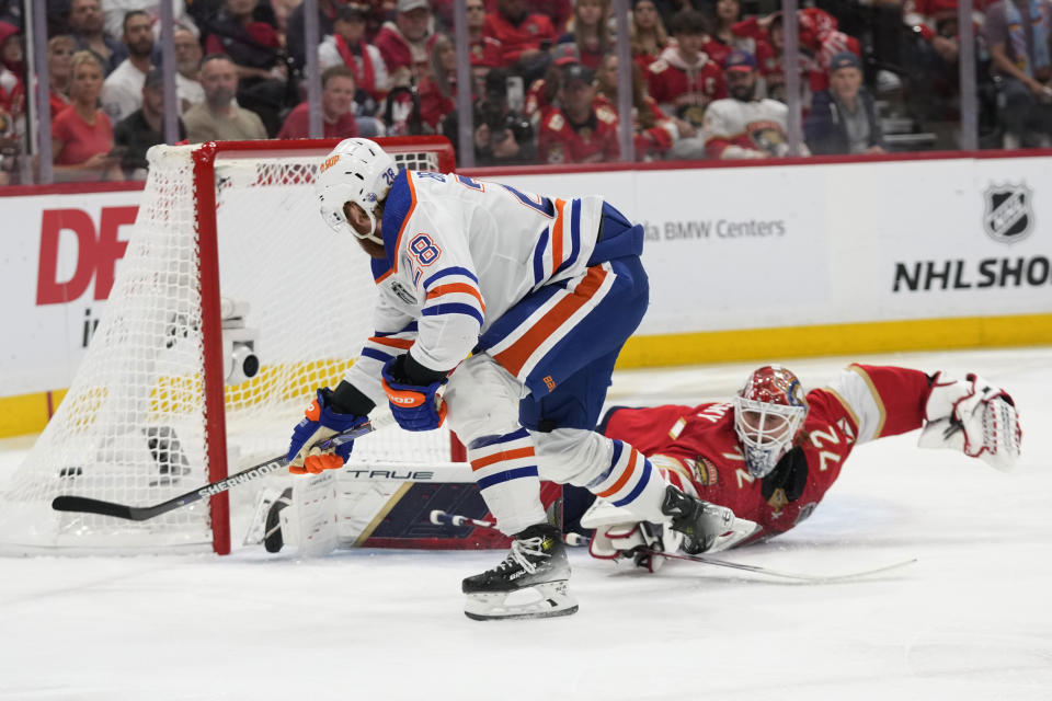 Edmonton Oilers right wing Connor Brown (28) scores a goal against Florida Panthers goaltender Sergei Bobrovsky (72) during the first period of Game 5 of the NHL hockey Stanley Cup Finals, Tuesday, June 18, 2024, in Sunrise, Fla. (AP Photo/Wilfredo Lee)