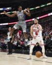 Chicago Bulls' Zach LaVine (8) gets Sacramento Kings' De'Aaron Fox off his feet during the second half of an NBA basketball game Wednesday, March 15, 2023, in Chicago. (AP Photo/Charles Rex Arbogast)