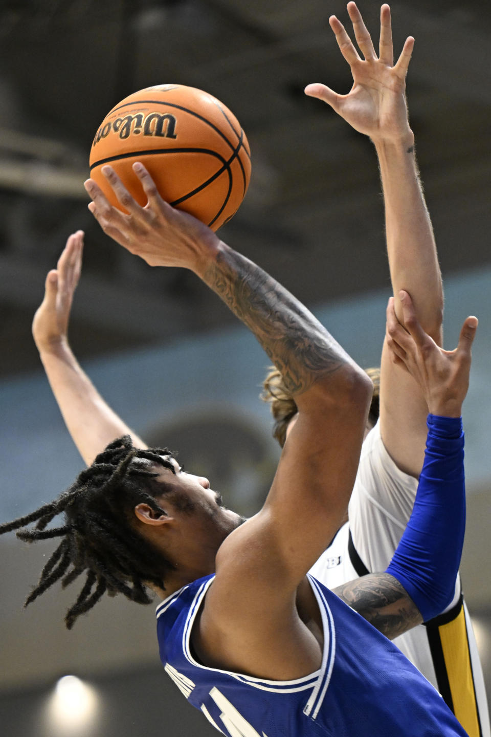 Seton Hall guard Dre Davis (14) shoots against Iowa forward Owen Freeman during the second half of an NCAA college basketball game Friday, Nov. 24, 2023, in San Diego. (AP Photo/Denis Poroy)