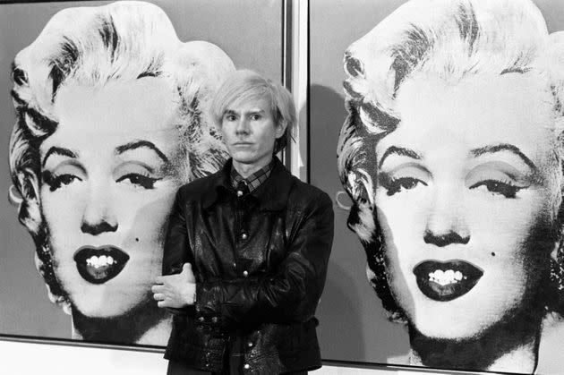 Andy Warhol stands in front of his double portrait of Marilyn Monroe at the Tate Gallery, Millbank. (Photo: PA Images via Getty Images)