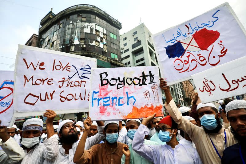 Muslims take part in a protest in Dhaka