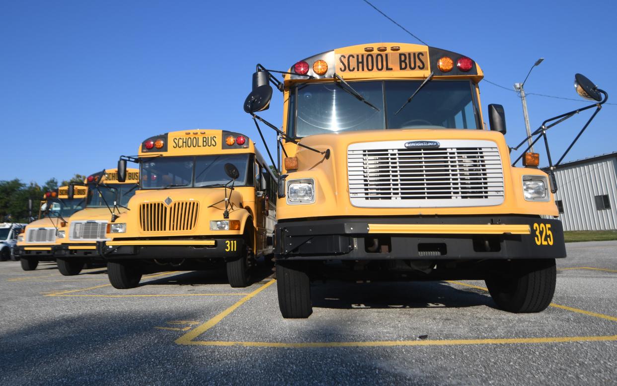 School buses are lined up at the New Hanover County Schools main bus lot in Wilmington, N.C., in September 2021. Parents have reported issues with bus routes since the start of the 2022-23 school year.