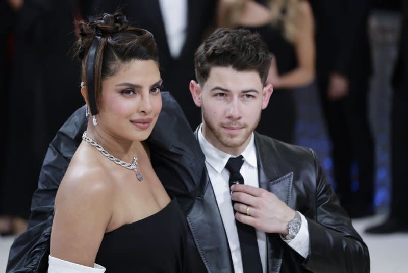 Nick Jonas (R) kicked off his new tour with the Jonas Brothers with Priyanka Chopra and their daughter Malti in the audience. File Photo by John Angelillo/UPI