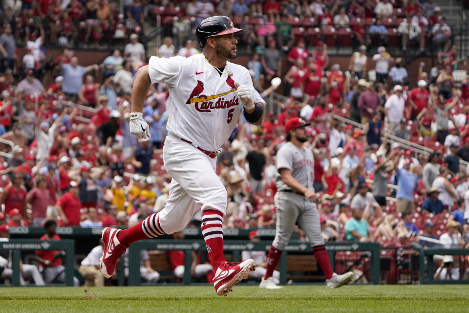 CORRECTS TO ONE RUN SCORED NOT TWO RUNS - St. Louis Cardinals' Albert Pujols (5) rounds first on his way to a ground rule-double scoring Tyler O'Neill during the fifth inning of a baseball game against the Cincinnati Reds Sunday, June 12, 2022, in St. Louis. (AP Photo/Jeff Roberson)
