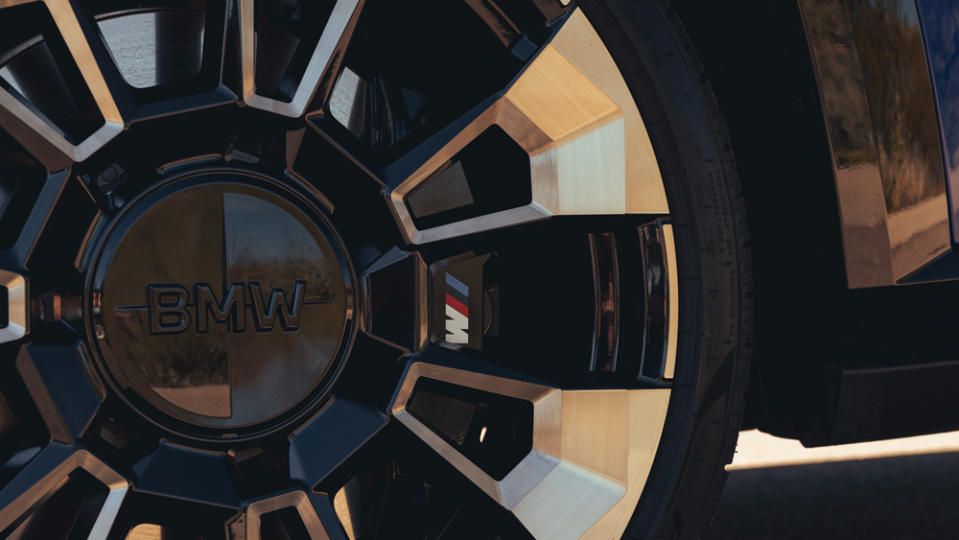 A close-up of one of the 23-inch wheels, wearing Pirelli P Zero summer tires, on a 2023 BMW XM.