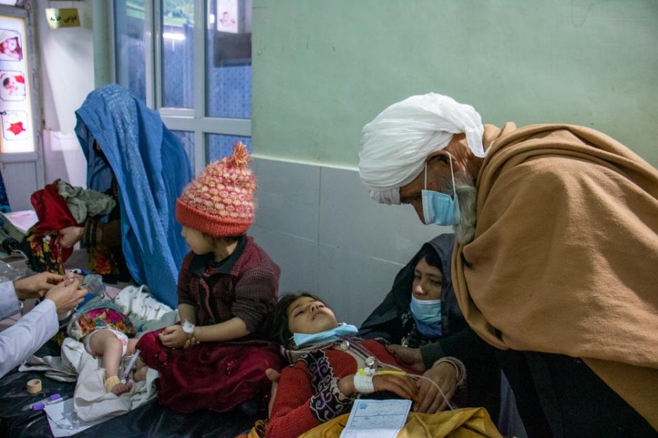 Aid workers are reporting increasing numbers of people travelling for miles from their homes to get treatment at health centres and hospitals. Hadi and his daughters are being seen in a hospital in northwestern Afghanistan (Arete/DEC)