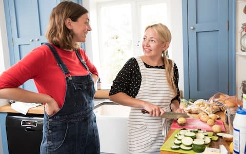 Hattie Garlick being taught by food stylist and cook Rosie Birkett on how to feed her family of four organically on a budget .  - Credit: Heathcliff O'Malley