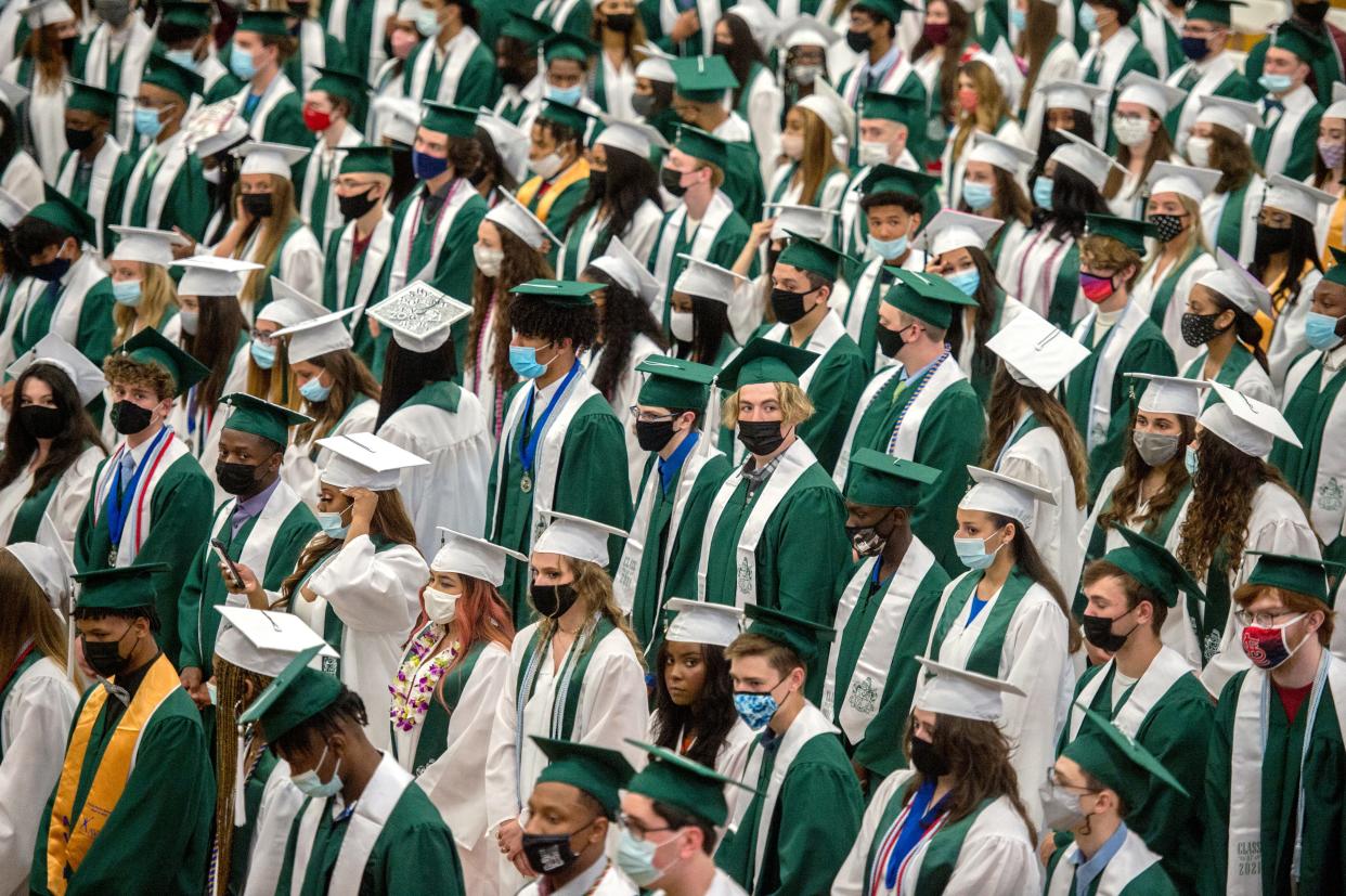 More than 300 graduates take their spots in the gym for a graduation ceremony Saturday, May 15, 2021, at Richwoods High School in Peoria.