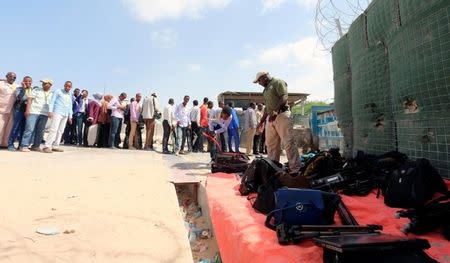 Journalists queue for a security sweep outside the venue of the presidential vote at the airport in Somalia's capital Mogadishu February 8, 2017. REUTERS/Feisal Omar