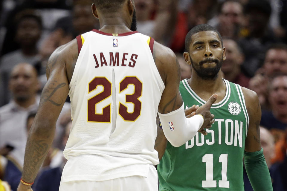 Kyrie Irving appears frustrated with having to field questions about his departure from Cleveland. (AP)