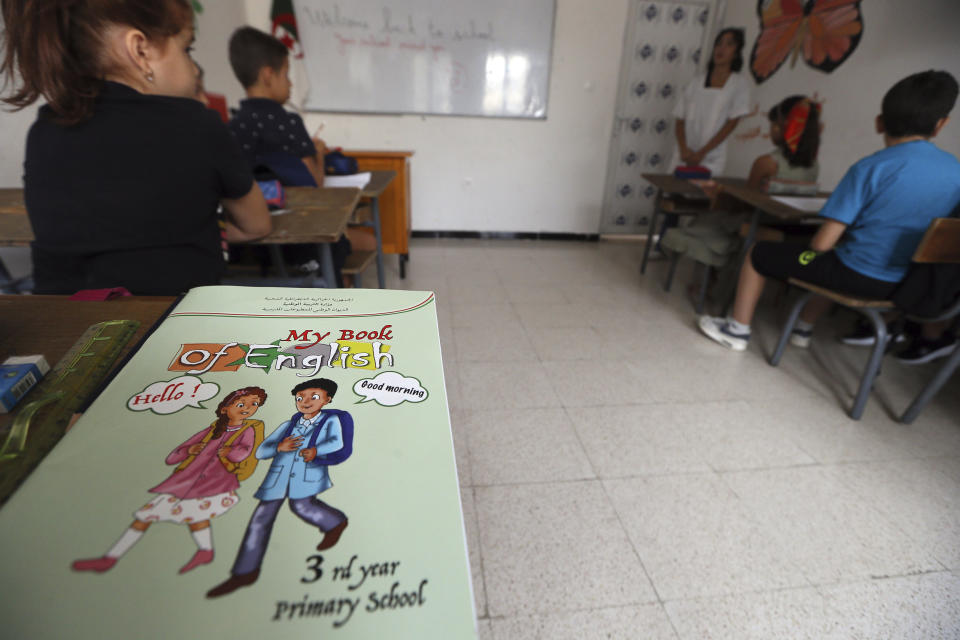 Schoolchildren attend an English lesson in a private school of Birkhadem, outside Algiers, Wednesday, Sept.21, 2022. Algerian children went back to school Wednesday Sept. 21, 2022 for the first time since the president last month ordered schools to switch from teaching French as a second language alongside Arabic to English instead. The government says the move is a modernization effort but it is also seen as a way for Algeria to distance itself from its past as a French colony. (AP Photo/Fateh Guidoum)