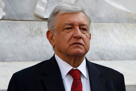 Leftist front-runner Andres Manuel Lopez Obrador is pictured during a floral tribute to mark the 212th anniversary of the birth of president Benito Juarez, at the Hemiciclo a Juarez monument in Mexico City, Mexico March 21, 2018. REUTERS/Ginnette Riquelme