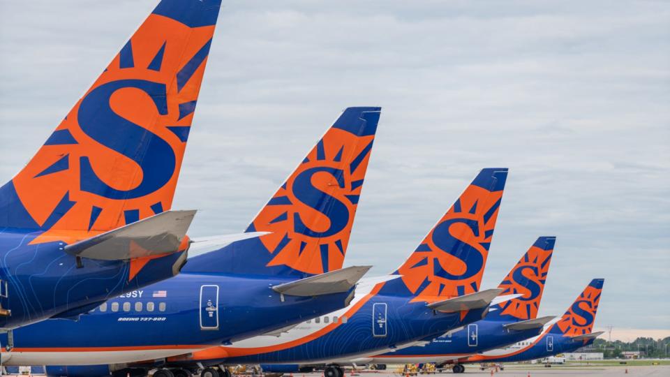 A row of Sun Country Airlines jets.