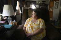 Doris Kelly, 57, sits in her home on Monday, June 29, 2020 in Ruffs Dale, Pa. Kelly was one of the first patients in a UPMC trial for COVID-19. “It felt like someone was sitting on my chest and I couldn’t get any air,” Kelley said of the disease. (AP Photo/Justin Merriman)