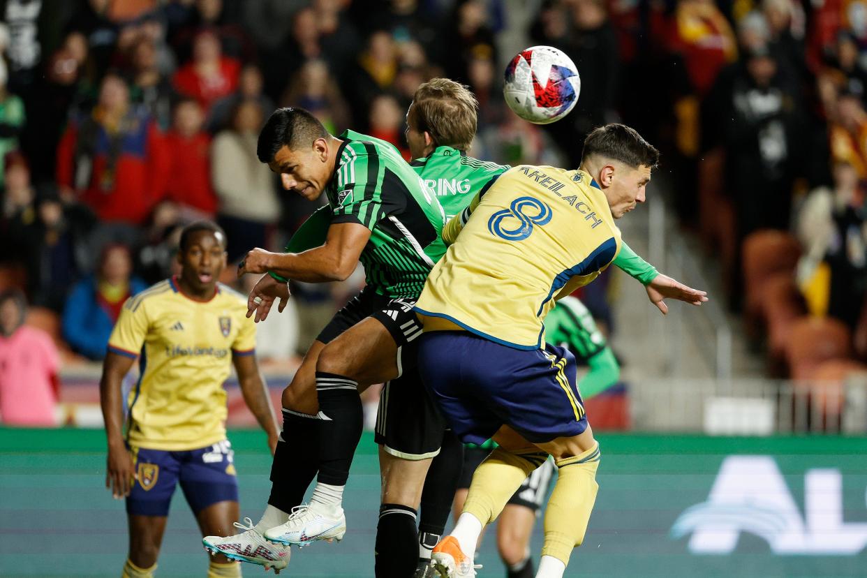 Austin FC defender Nick Lima, center, and forward G.yasi Zardes battle Real Salt Lake midfielder Damir Kreilach in the second half of El Tree's win on March 11. Austin FC will play at the Houston Dynamo on Saturday.