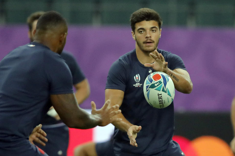 France's Romain Ntamack passes the ball during a training session in Oita, Japan, Friday Oct. 18, 2019. France will face Wales in the quarterfinals at the Rugby World Cup on Oct. 20.(AP Photo/Christophe Ena)