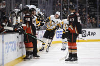 Pittsburgh Penguins center Evgeni Malkin (71) is congratulated on his goal against the Anaheim Ducks in the second period of an NHL hockey game in Anaheim, Calif., Tuesday, Jan. 11, 2022. (AP Photo/Kyusung Gong)