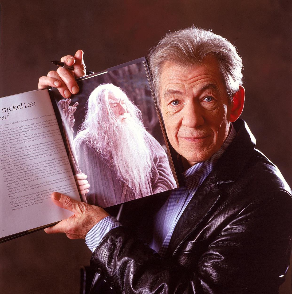 Ian McKellen holds up a picture of Gandalf while promoting "The Lord of the Rings" in 2001.