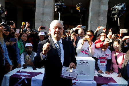 Mexico's President-Elect Andres Manuel Lopez Obrador talks to reporters before casting his vote in a public consultation on the fate of a $13.3 billion USD Mexico City International Airport project, in Mexico City, Mexico October 25, 2018. REUTERS/Andres Stapff