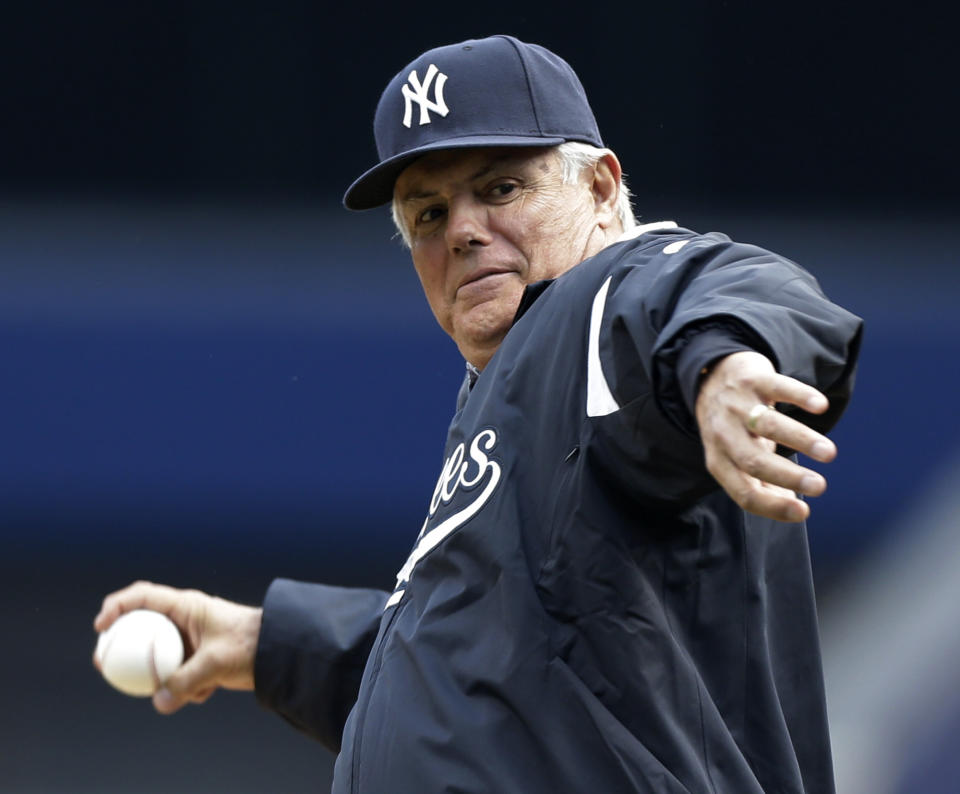 FILE - Lou Piniella throws out the ceremonial first pitch at an Opening Day baseball game between the Red Sox and the New York Yankees at Yankee Stadium in New York, April 1, 2013. Piniella, Jim Leyland, Cito Gaston and Davey Johnson are among eight men on the ballot for the Hall of Fame’s contemporary era committee for managers, executives and umpires that meets on Dec. 3, 2023, at the winter meetings in Nashville, Tenn. (AP Photo/Kathy Willens, File)