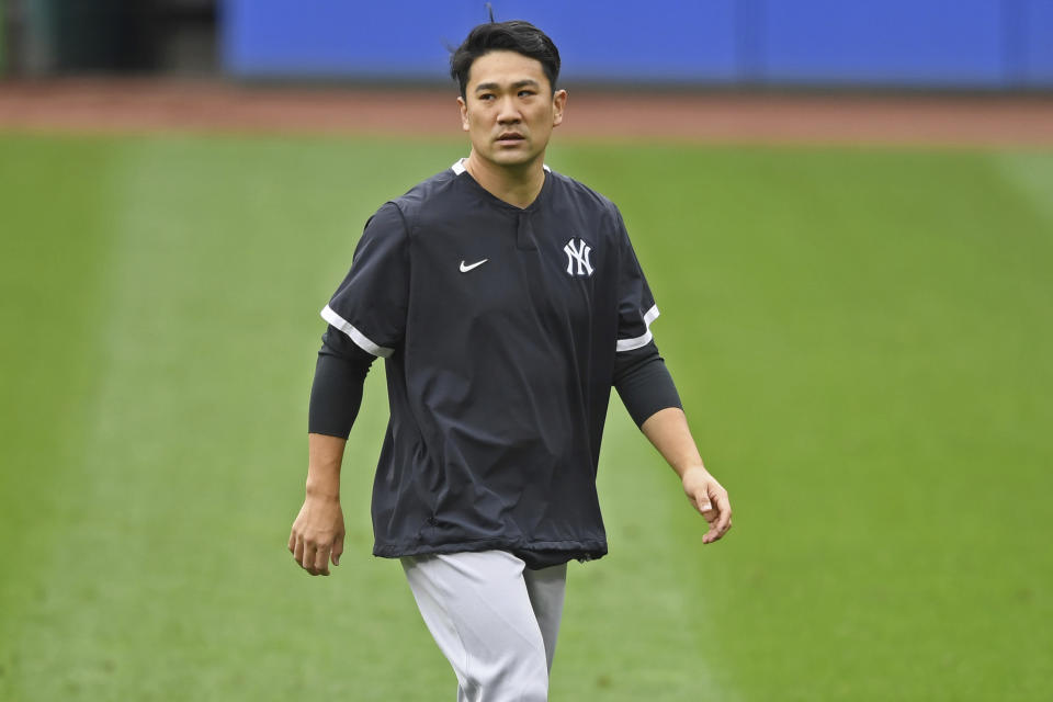 FILE - New York Yankees starting pitcher Masahiro Tanaka walks on the field before Game 1 of an American League wild-card baseball series against the Cleveland Indians in Cleveland, in this Tuesday, Sept. 29, 2020, file photo. Former New York Yankees pitcher Masahiro Tanaka has signed a two-year contract with the Rakuten Eagles in Japanese baseball, the club said Thursday, Jan. 28, 2021. (AP Photo/David Dermer, File)